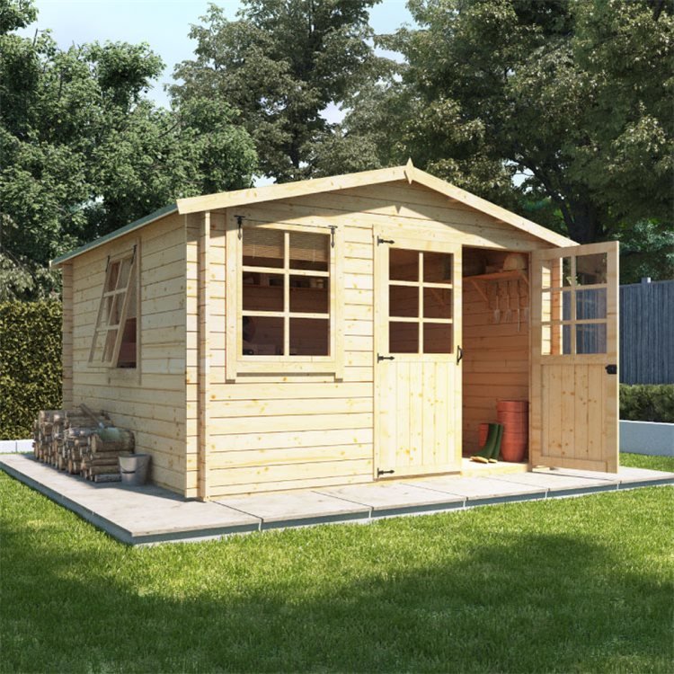 The BillyOh Clubman Heavy Duty Shed Log Cabin on a small paving deck surround by grass and trees