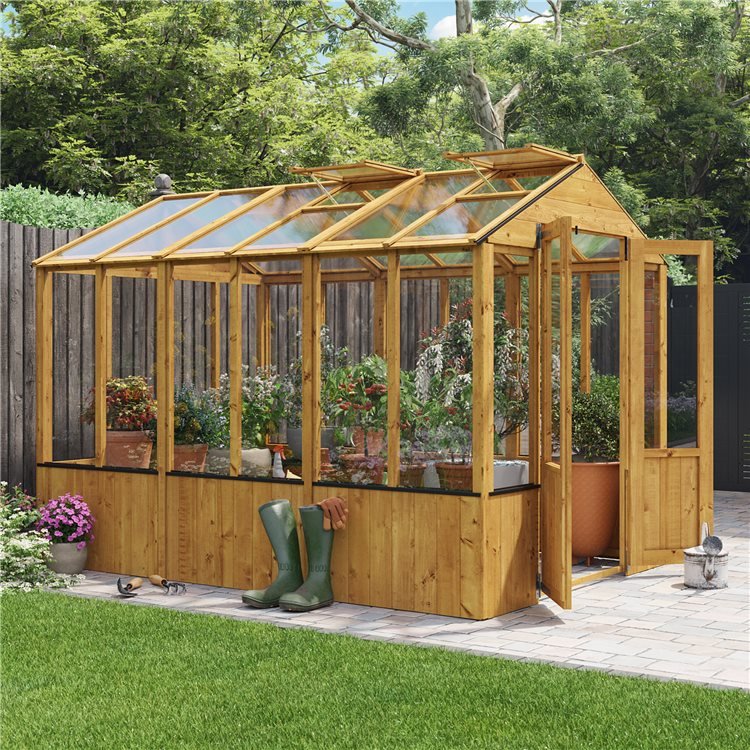 Lincoln Wooden greenhouse with vents open in a modern garden