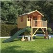 Lollipop Junior Tower playhouse with slide standing in a sunny green garden