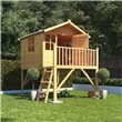 Lollipop Tower Playhouse with ladder with decorative plants in a neat garden