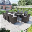 Siena 8 Seater Rectangular Rattan Dining Set in a large grassy garden with a house in the background.